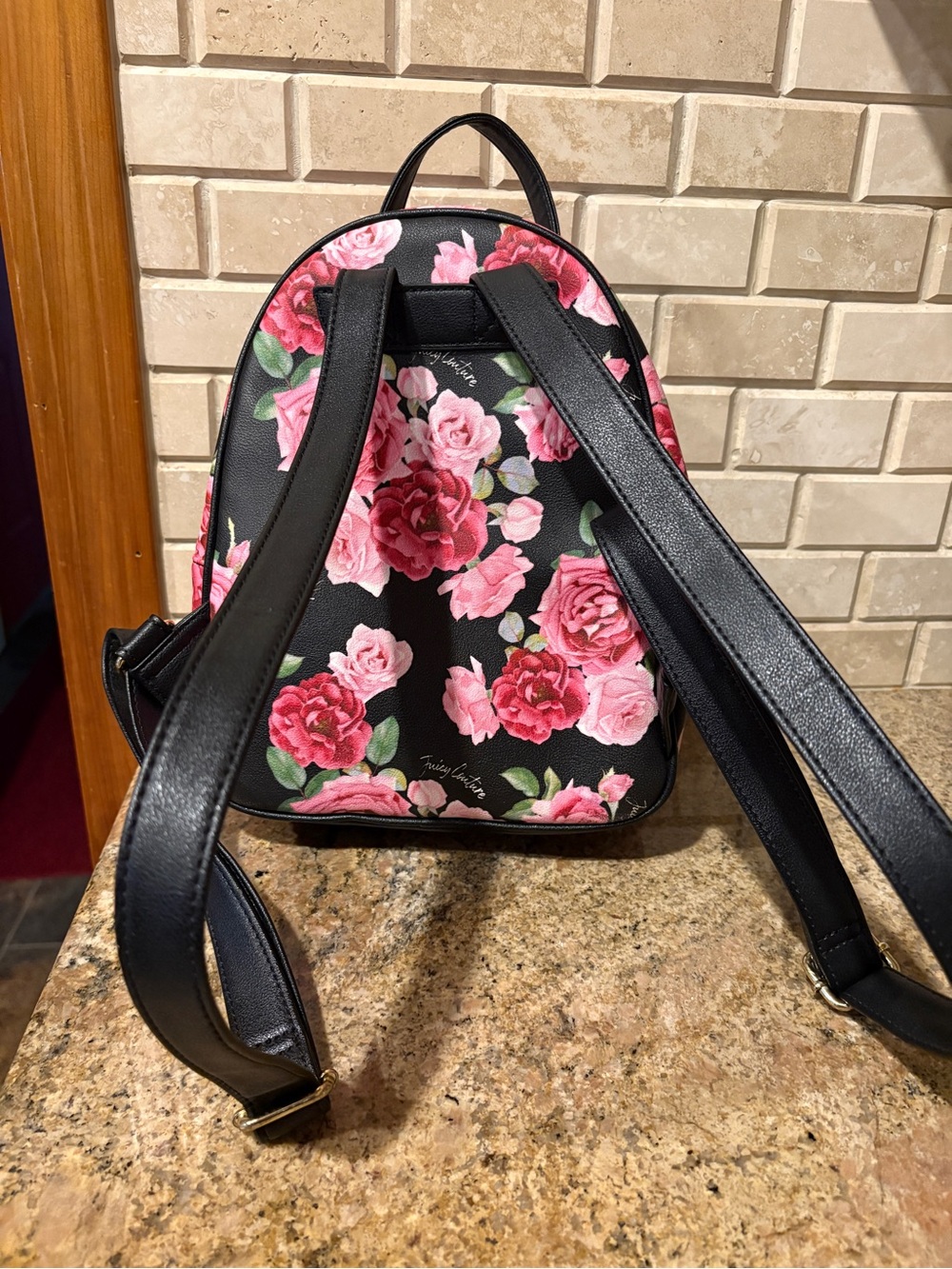 Juicy Couture mini backpack.